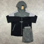 Nike Windrunner Black Grey Shorts Set – black, grey and white colour-block hooded jacket with grey Nike shorts laid flat with tag attached