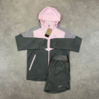 Nike Windrunner Pink Foam Shorts Set – pink and grey colour-block hooded jacket with matching grey shorts laid flat with tags attached