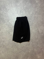 ASICS Icon Shorts Black – black athletic shorts with small white ASICS logo, reverse side laid flat